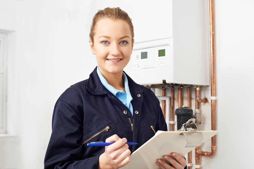 BoilerRight services section a female engineer holding a notepad.